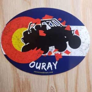 Ouray side by side exploding out of a Colorado grunge flag