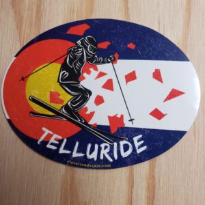 Telluride Skier busting out of a Grunge Colorado Flag