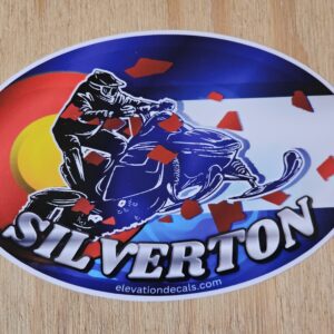 Silverdale snowmobile rider with Colorado flag