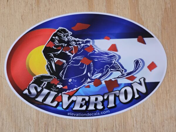 Silverdale snowmobile rider with Colorado flag