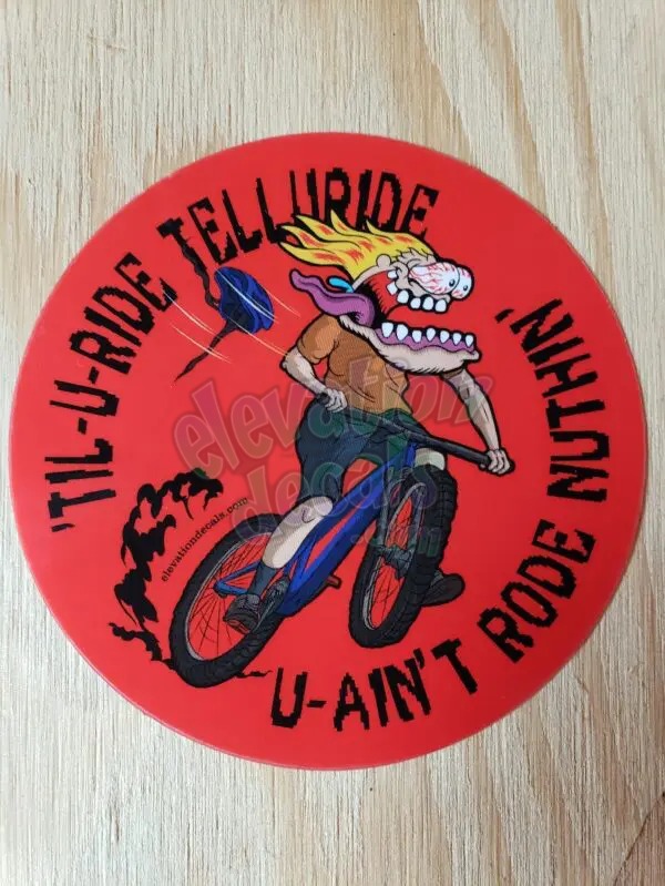 Til you ride Telluride mountain bike oval sticker with AJ riding the bike