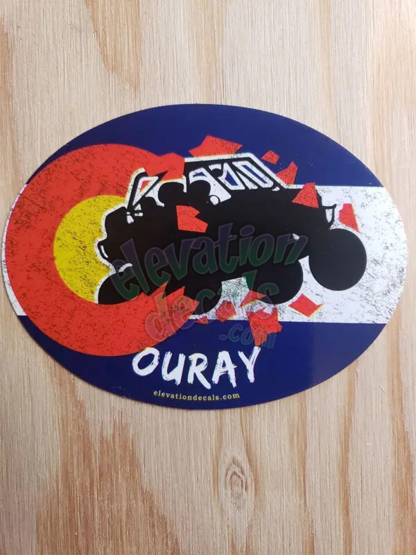 Ouray side by side exploding out of a Colorado grunge flag